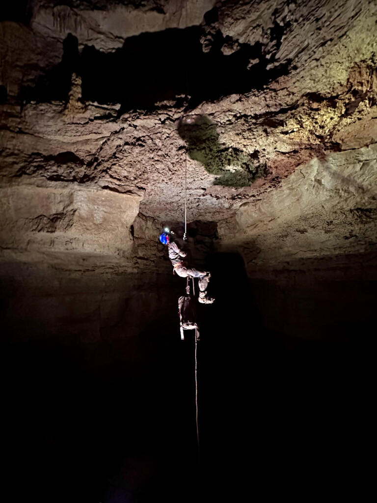 Caver on rope